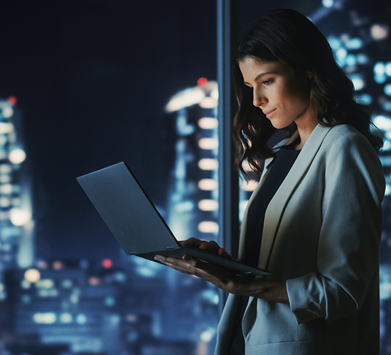 Girl holding a laptop with a beautiful view